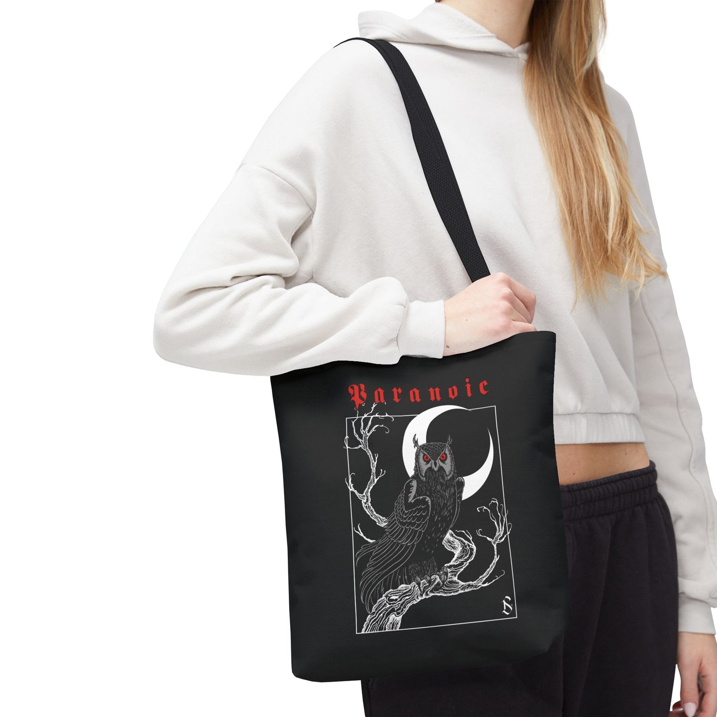 Model carrying the black Owl by D.S. Gargots tote bag, cropped below the head