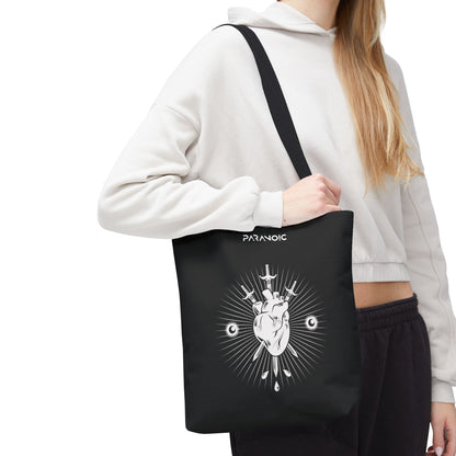 Model carrying the black Anatomical Heart tote bag, cropped below the head