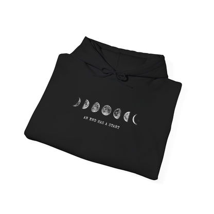 Folded black Moon Phases hoodie showing the printed design