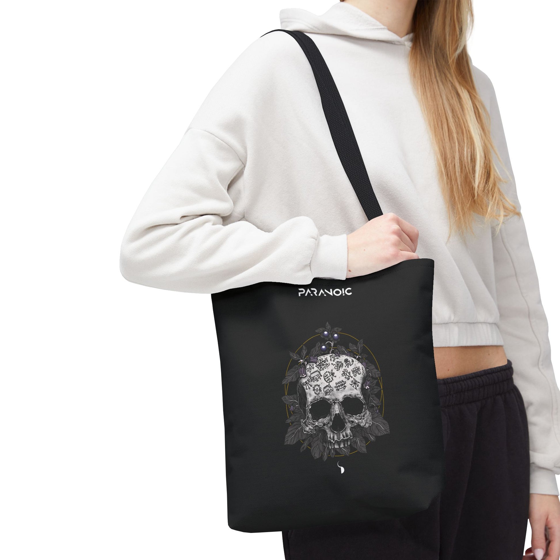 Model carrying the black Skull by D.S. Gargots tote bag, cropped below the head